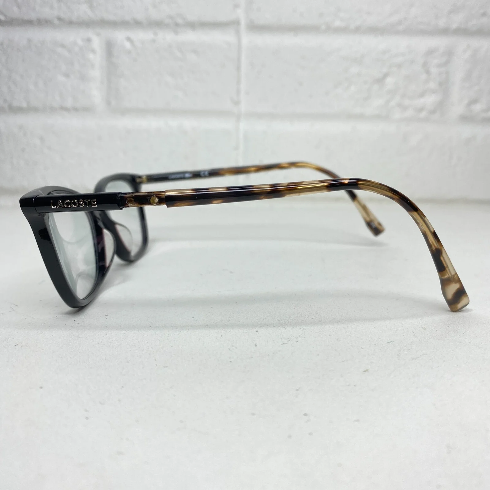 Lacoste Eyeglasses Frames Black Gold Women 2