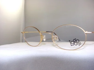 LOGO NX2440 OVAL EYEGLASS FRAME IN GOLD SIZE 47-20 2