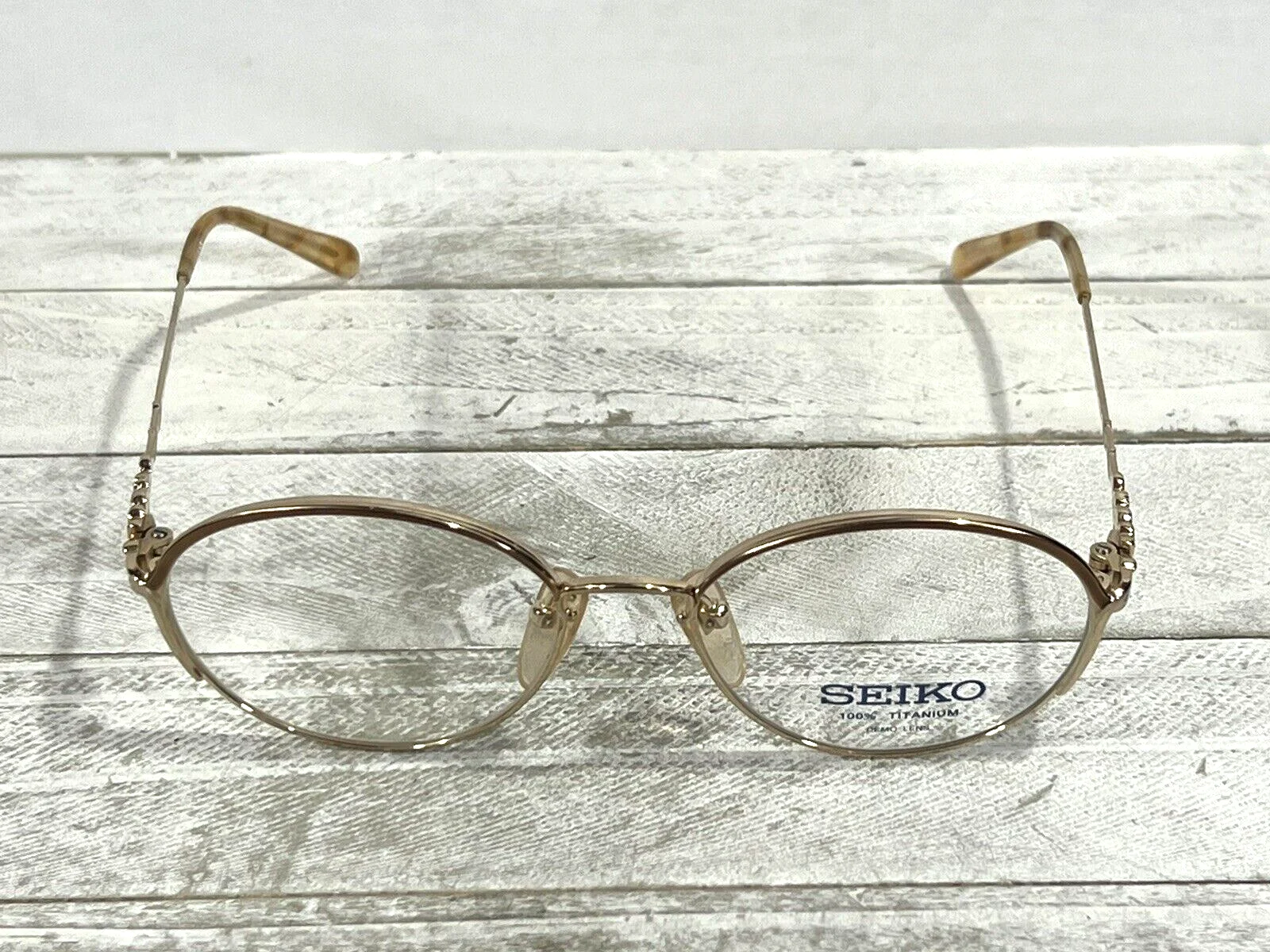 Seiko T001 Womens Eyeglass Frames Display Model Titanium Frame Gold 52▯17-135 3